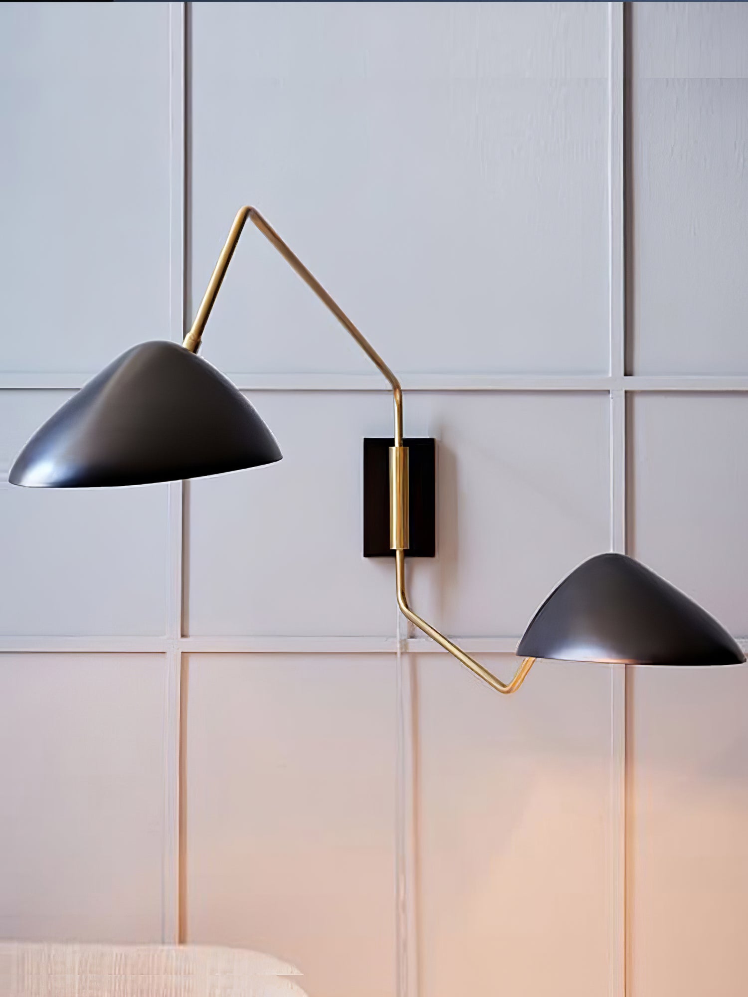 Applique à bras oscillant
