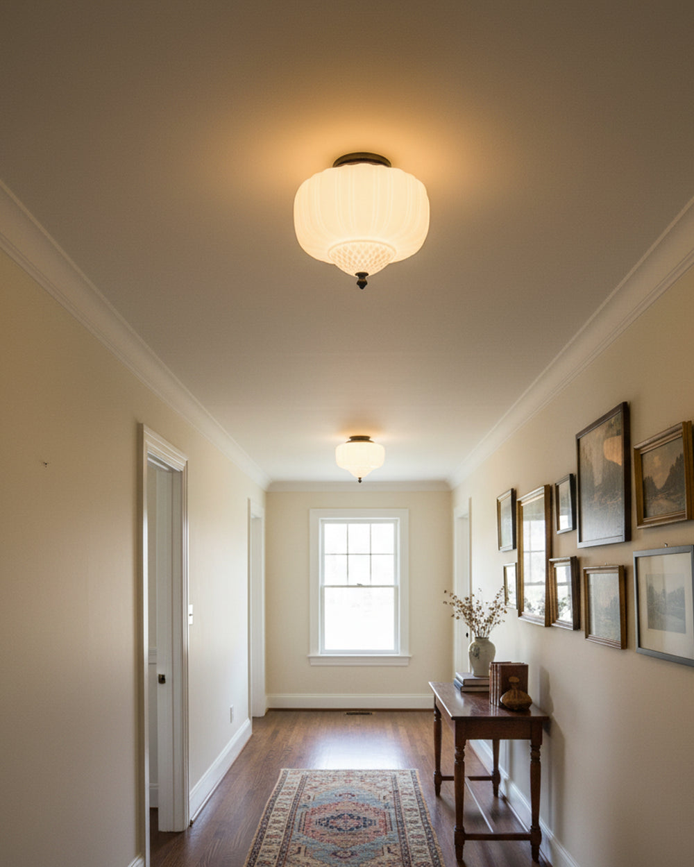 Glass flush mount ceiling lights along a hallway