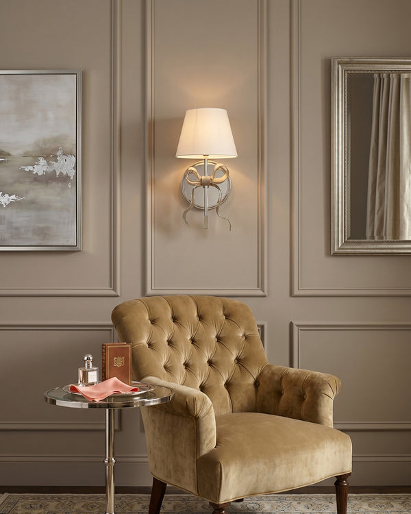 Colette Mirrored Bow Wall Sconce in a hallway