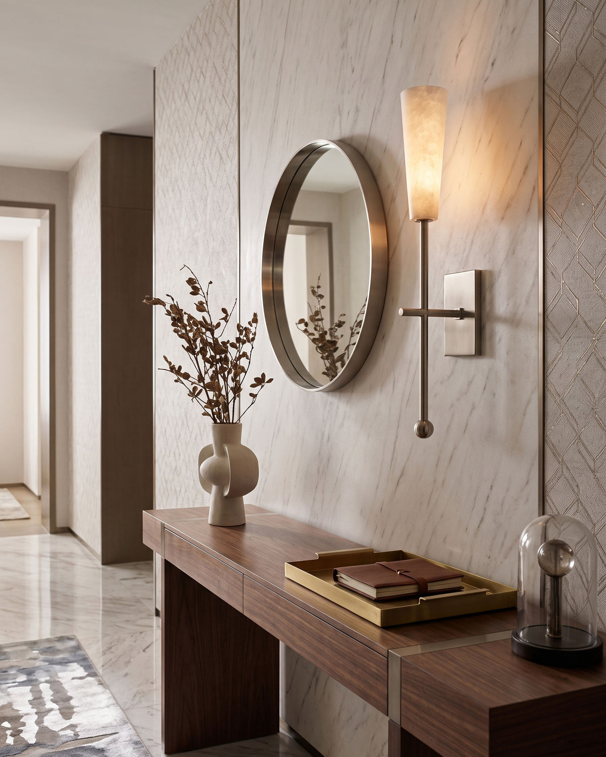 Alaric Alabaster Wall Sconce lit in a room setting
