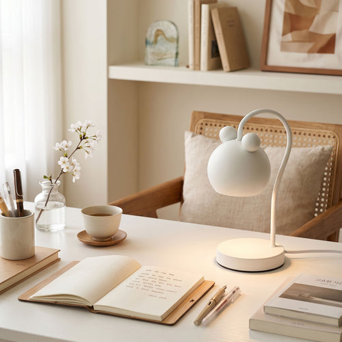 Fia Elegant Curved Table Lamp warming a jar candle